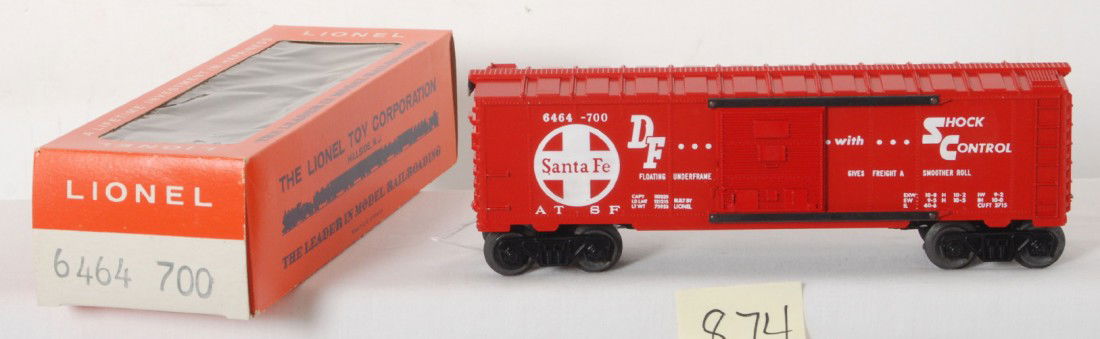 Lionel No. 6464-700 Santa Fe boxcar, unrun in OB: Postwar Lionel O gauge No. 6464-700 Santa Fe boxcar in original box, unrun. Car has a scuff on a panel next to a door about half inch long, otherwise car looks unrun C9-10. Could have happened when do