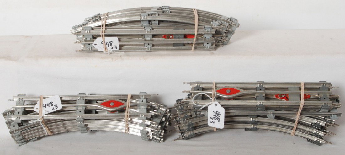 Lionel 027 track, some in wire clips: Postwar Lionel 027 track. Two straight bundles with wire clips. Some track is unrun. Curved, straight and uncoupling sections with no controllers present. Very clean lot of track.