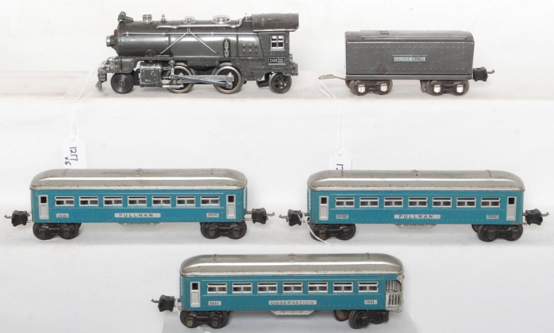 Lionel 249E, 2689W, 2630, 2630, 2631 pass. train: Prewar Lionel O gauge No. 249E steam locomotive and No. 2689W whistle tender, both in gun metal gray. Trains are accompanied by two No. 2630 Pullman coaches and a No. 2631 observation car. Trains are