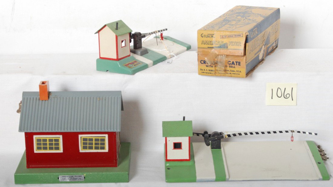 American Flyer 50, 600 in OB, and 591: Postwar American Flyer S ga. accessories, 50 District School house, 591 crossing gate, and 600 crossing gate with warning bell in original box. No. 50 has missing corner of roof, otherwise accessories