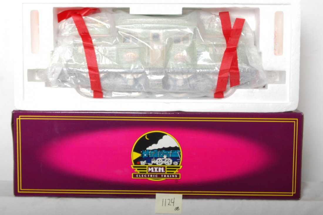 MTH Apple Green MT-1022 408E electric locomotive: MTH modern standard gauge tinplate MT-1022 Apple Green 408E electric locomotive in OB. Loco is factory wrapped in the inner carton C9-10. OB has some light wear.