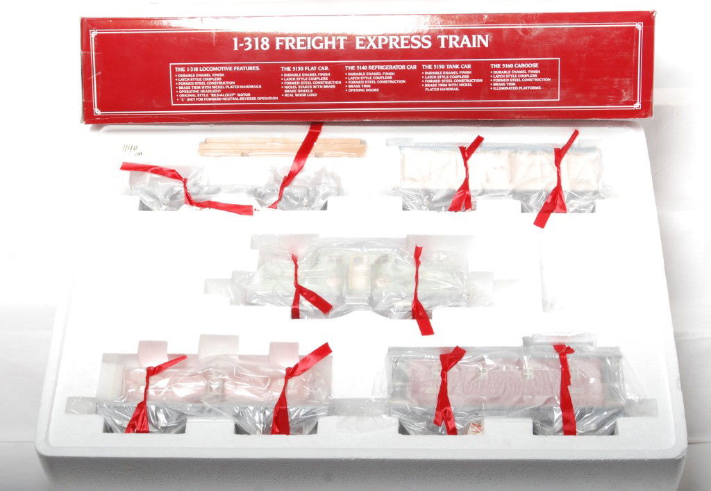 Lionel 13001 1-318 freight express train: Lionel Classics modern standard gauge tinplate 13001 1-318 freight express train in OB. Set is factory wrapped in the inner carton and trains are C9-10. OB has damage at the corners and also clear tap
