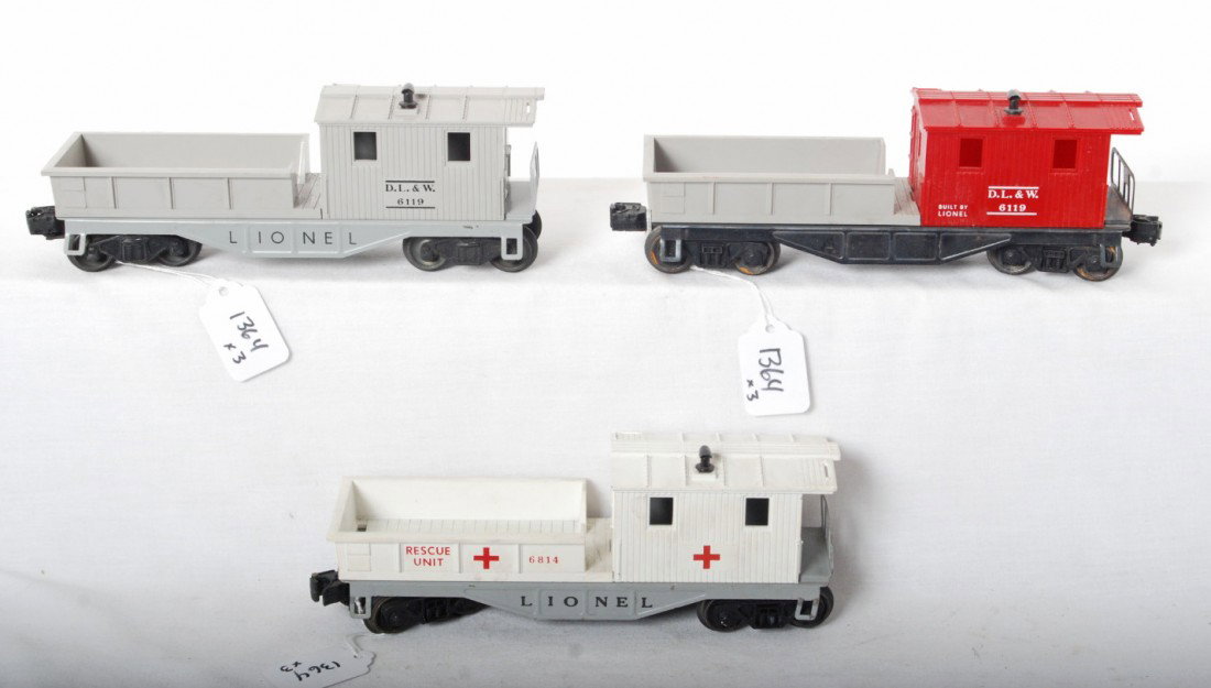 Lionel 6119, 6119, 6814 work cabooses: Postwar Lionel O ga. 6119 Delaware, Lackawanna, and Western; 6119 Delaware, Lackawanna, and Western; and 6814 Rescue Unit work cabooses, C7. Both 6119 look unrun.