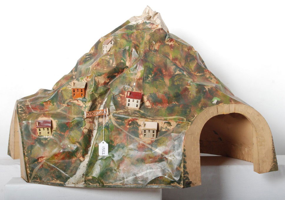 Lionel prewar S.G. 140L tunnel: Prewar Lionel standard gauge 140L mountain tunnel, constructed of tin. Tunnel measures approximately 37-3/4 inches long at back corners of openings, 20-1/2 inches wide at widest point, and 22-3/4 inch