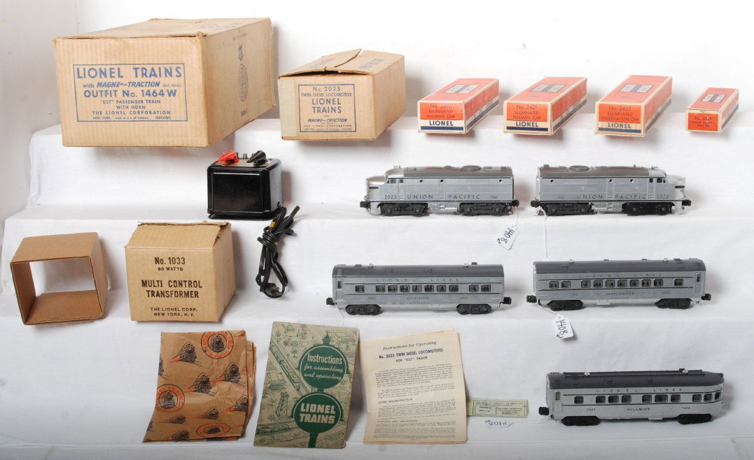 Nice Lionel silver 1464W passenger set, 2023 UP: Lionel postwar O gauge boxed set 1464W including a very nice set box with all flaps intact. Trains include a 2023 Union Pacific Alco set, 2421 Maplewood, 2422 Chatham and 2423 Hillside passenger cars.