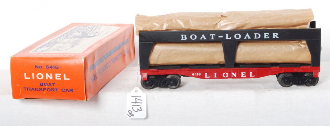 Mint Lionel 6416 boat loader car in OB: Lionel postwar O gauge 6416 boat transport car, unrun with mint boats in wrap, C9-10. OB is complete with no tears, minor creasing so C8.
