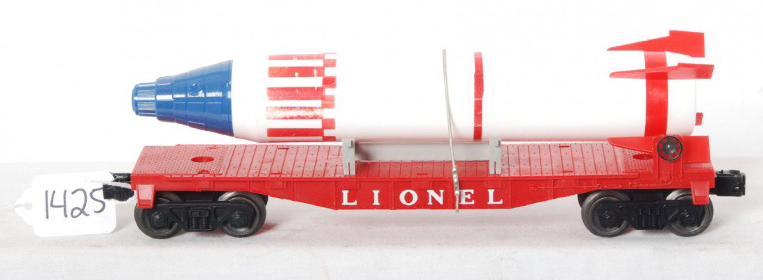 Lionel 6407 flat with original Sterling rocket: Lionel postwar O gauge 6407 flat with original Sterling rocket, C8.