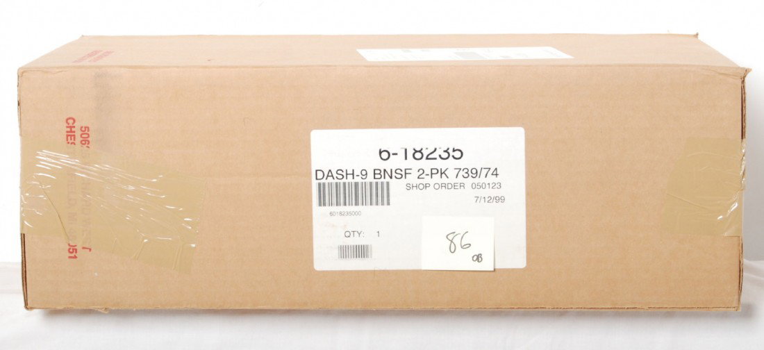 Lionel BNSF 18235 Dash nine two pack: Lionel modern O gauge 18235 BNSF Dash 9 locomotive two pack in OB. According to catalog both units are powered with TMCC, Railsounds and more. Locos are factory sealed in master carton. C10.