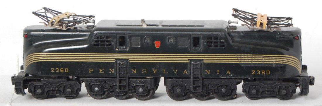 Lionel 2360 Pennsylvania 5 stripe GG-1 electric lo: Postwar Lionel O gauge 2360 Pennsylvania GG-1 5 stripe dark green electric locomotive. Touchups and new stripes, C6. Pantographs are missing insulators and have some light surface rust.