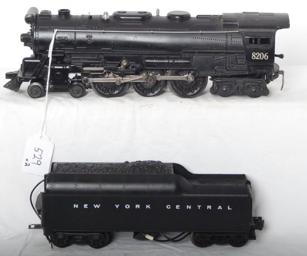 Lionel 8206 steam locomotive and 2671W-6 tender: Modern era Lionel 8206 steam locomotive with smoke and headlight and 2671W-6 New York Central tender w/sound. Loco was briefly tested on a short section of test track and operated smoothly in forward