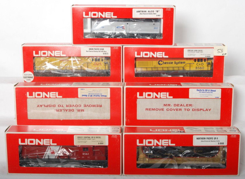 7 Lionel dummy units 8573, 8254, 8560, 8255, etc.: Lionel modern O gauge dummy diesel locomotives. 8573 Union Pacific U36B with horn, 8254 Illinois Central GP9, 8560 Chessie U36B, 8667 Amtrak Alco B, 8255 Santa Fe GP9, 8668 Northern Pacific GP9, and J