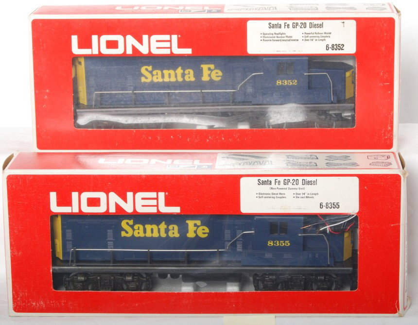 Lionel Santa Fe 8352 and 8355 GP20 locos: Lionel modern O gauge Santa Fe GP20 diesel locomotives in OBs. Includes 8352 and 8355 powered and dummy. Locos are C9-10. OBs have some light wear at the corners and small pen writing on one end.