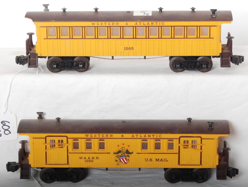 Lionel 1865 and 1866 Western and Atlantic passenge: Postwar Lionel O gauge 1865 Western and Atlantic baggage car and 1866 Western and Atlantic passenger coach with missing roof corner, chipped handrail/step, and price sticker on roof, otherwise should