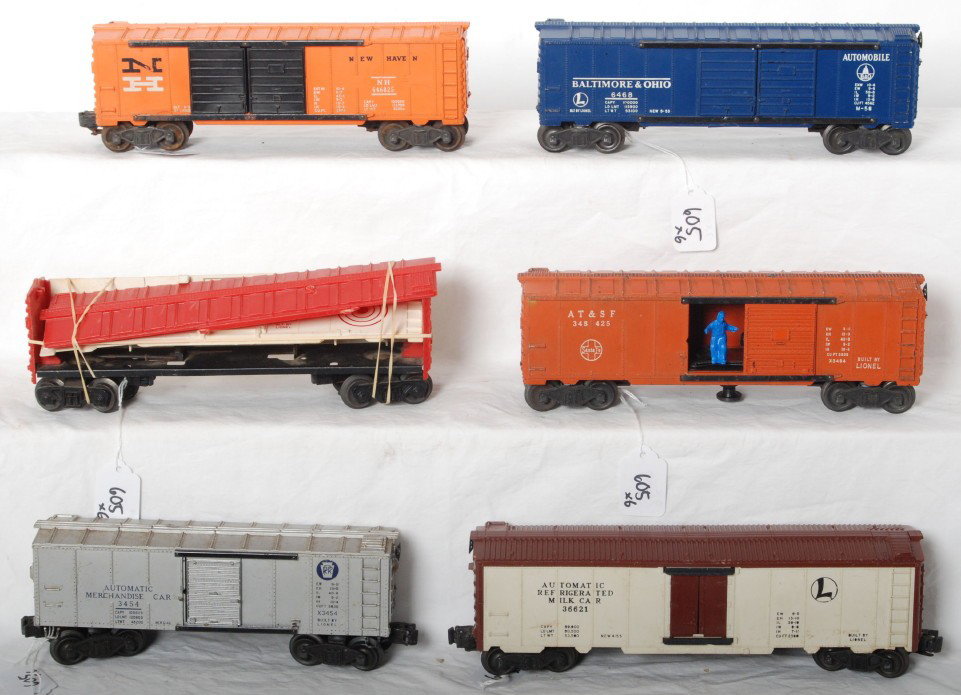 Lionel 3484-25, 6468-25, 6448, 6468, 3662, 3454: Postwar Lionel O gauge 3484-25 A.T.S.F. operating boxcar, 6468-25 New Haven operating boxcar, 6448 target car, 6468 Baltimore and Ohio double door automobiles boxcar, 3662 operating milk reefer, and X