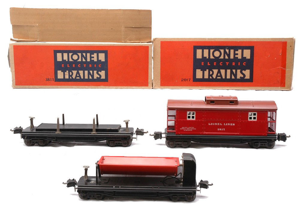 Lionel 3811 Lumber 3859 Dump 2817 Caboose: Lionel prewar O gauge 3811 remote control black lumber car in a worn OB with original cardboard insert, 3859 red dump car and a 2817 red rubber stamped caboose with a Tuscan roof in a worn OB. The cab