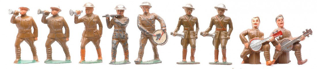 Manoil Grey Iron 9 Musical Military Figures: Manoil musical military figures including; two banjo players, three buglers, drummer and a fifer. Also included are two grey iron buglers. The drummer and fifer have paint loss and the fiferÕs helmet