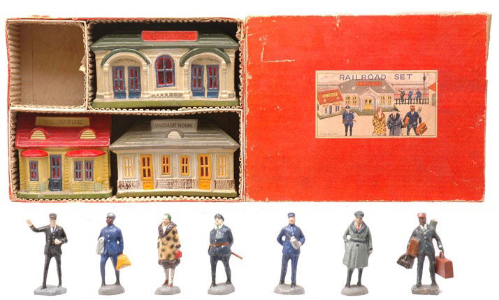 Esanbe Japanese Railroad Set LIKE NEW Boxed: Esanbe Japanese railroad set no. 185 with three composition buildings and seven figures in OB, C8. The box has nice labels intact.
