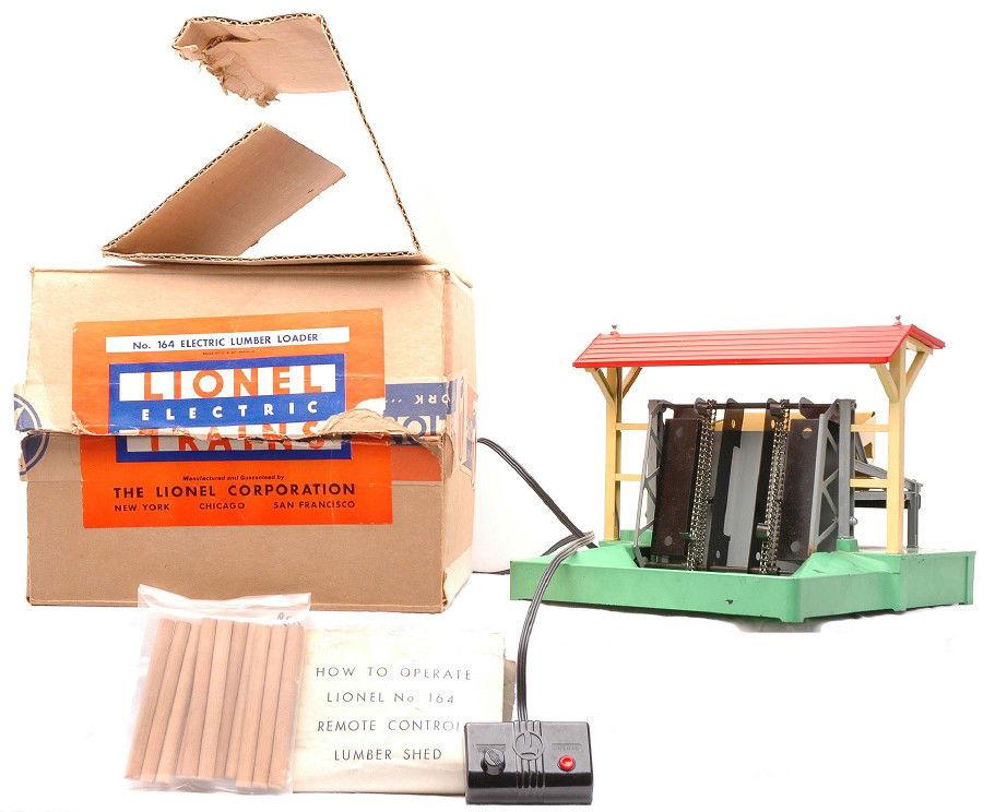 Lionel 164 Electric Lumber Loader-Gray OB: Lionel prewar 164 electric lumber loader with controller, logs and instruction sheet in OB that has an original cardboard insert. This is the harder to find gray version, circa 1942. The base has pain