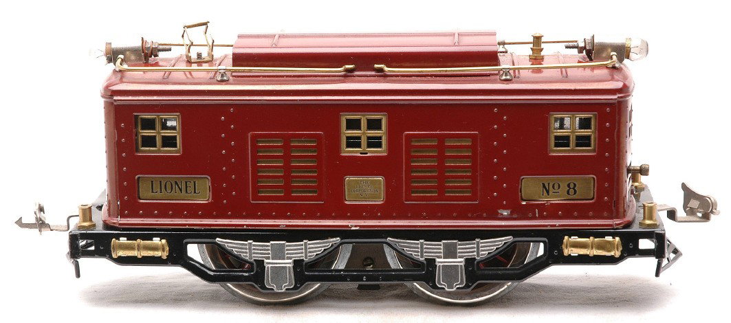 Lionel Std. Ga. no. 8 Maroon Electric Loco: Lionel prewar standard gauge no. 8 maroon 0-4-0 electric loco. The loco has been rewheeled and one of the pick up rollers has broken off. The engine appears to have been restored.
