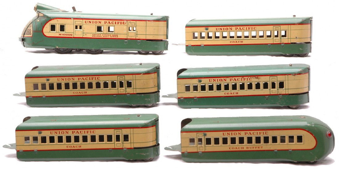 Marx Articulated Litho Gr/Cream UP Pass Set: Marx articulated lithographed green and cream Union Pacific passenger set including; M10000 electric loco, four 657 coaches and a 658 coach buffet car. The set is C6.