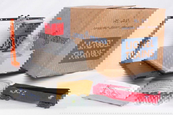 Lionel 345 operating culvert unloader, OB: Lionel 345 operating culvert unloader, has one hairline in the railing, the rest of the unloader is outstanding C9+ condition. Includes an unrun 6342, original culverts, inst. sheet, packet and ramp.