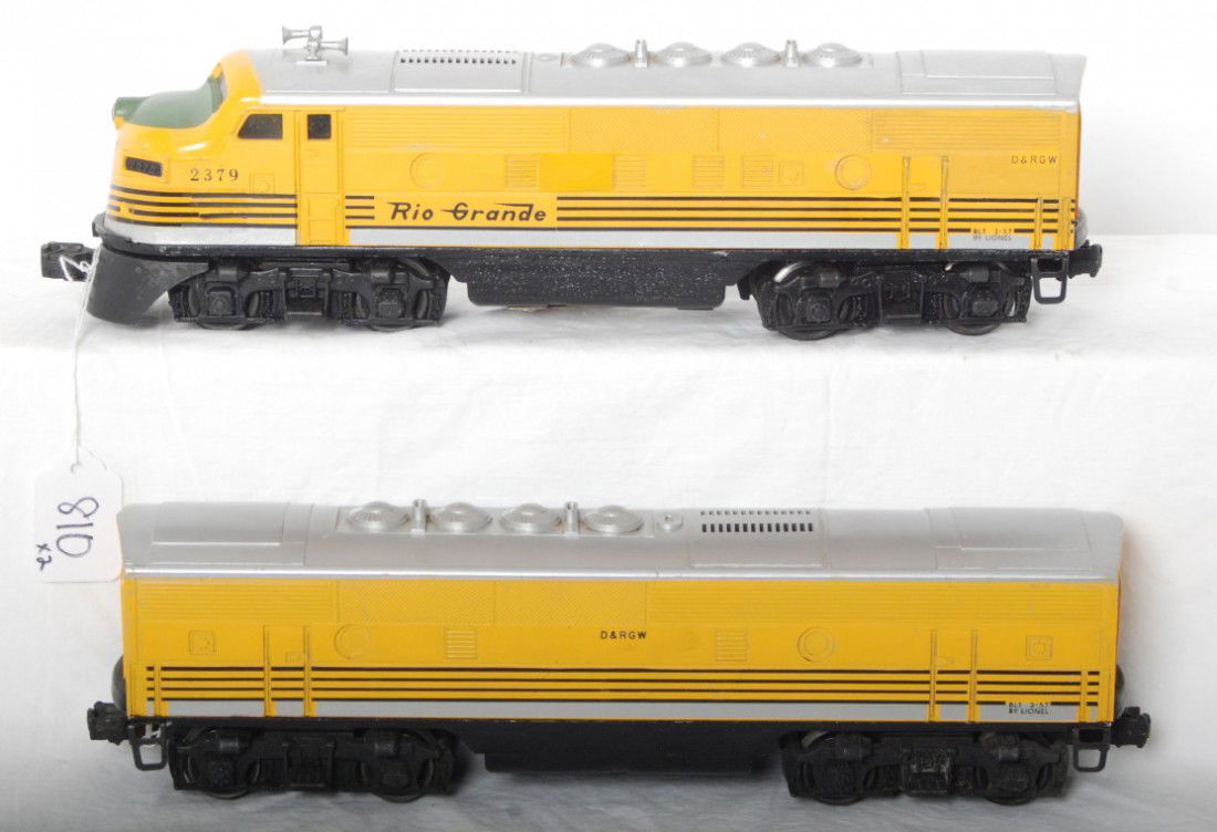 Lionel 2379P and 2379C Rio Grande F3 A-B units: Postwar Lionel O gauge 2379P and 2379C Rio Grande EMD F3 diesel A-B units. A unit has touchups to silver and pin stripes on nose and a repainted panel. Trains otherwise look C6.