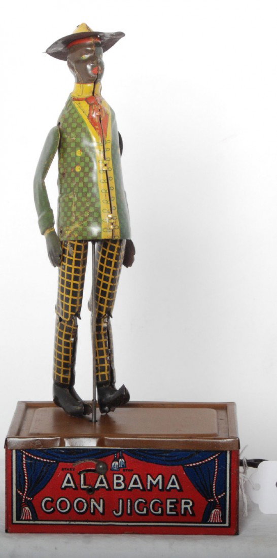 Strauss Tombo Alabama Coon Jigger mechanical toy: The Ferdinand Strauss Corporation Tombo Alabama Coon Jigger lithographed tinplate mechanical windup toy, C7. Toy should clean and polish to look a little better.