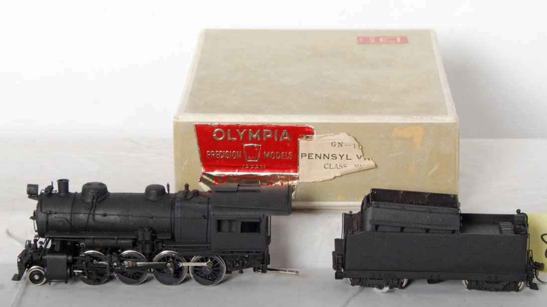 Olympia Models Japan, Gem Models PRR HIOS 2-8-0: Brass HO gauge Olympia Models Japan, Gem Models Pennsylvania class HIOS 2-8-0 steam locomotive and tender in original box with good foam, C8-9. Box shows very light wear, label is partially illegible.