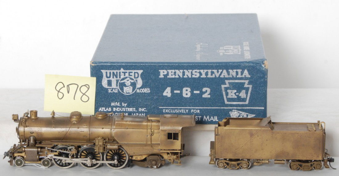 United Scale Models brass PRR 4-6-2 K-4 PFE in OB: Brass HO gauge United Scale Models, Atlas Industries Japan, Pacific Fast Mail, Pennsylvania K-4 4-6-2 steam locomotive and tender in original box with decals and literature. Train has light tarnish, C
