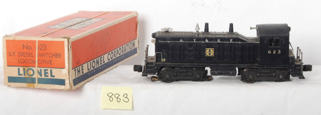 Lionel 623 S.F. NW-2 diesel switcher loco in OB w/: Postwar Lionel O gauge 623 A.T.S.F. Santa Fe NW-2 diesel switcher locomotive in original box with insert. Loco has distorted cab/shell, repro trim and hairlines at screw and rivets, C5. Box has missin
