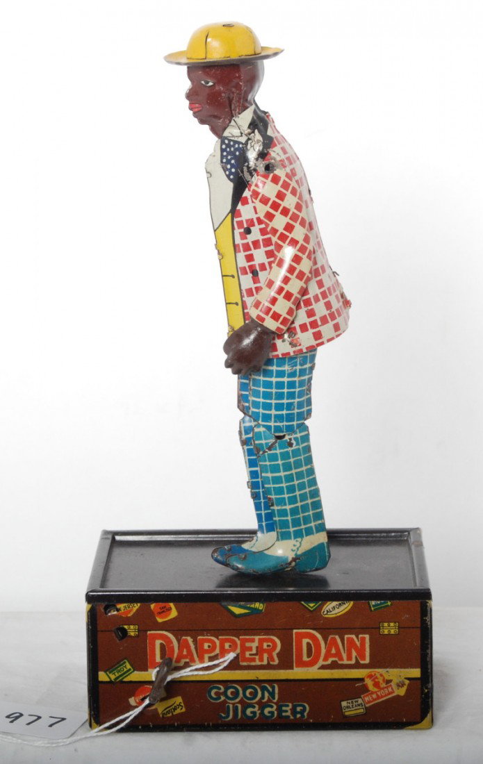 Marx Dapper Dan, Coon Jigger, The Jigging Porter t: Louis Marx & Co. Dapper Dan, Coon Jigger, The Jigging Porter lithographed tinplate mechanical windup toy with very solid, vivid and bright graphics, little if any rust, clean C7-8. Toy will clean and