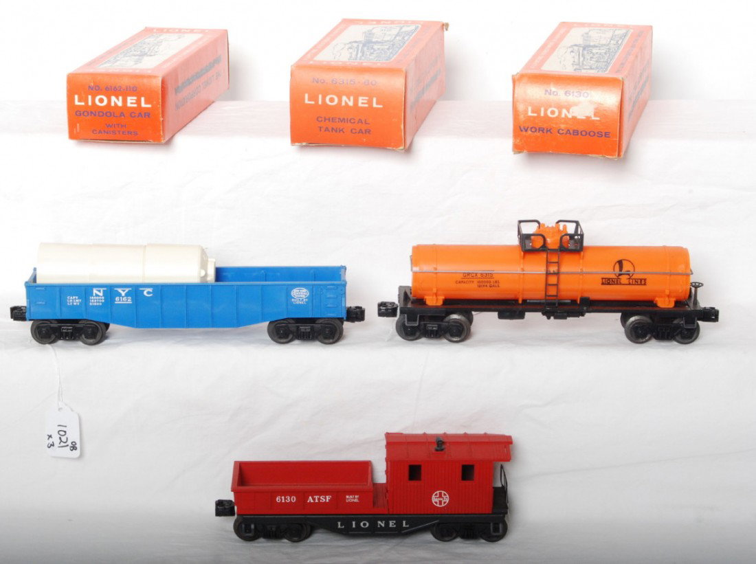 Lionel 6130, 6162-110, and 6315-60 in OB: Postwar Lionel O gauge 6130 A.T.S.F. Santa Fe work caboose, 6162-110 New York Central gondola with canisters, and 6315 GRCX chemical tank car, unrun C8-9. Boxes look C7-8.