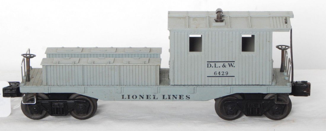 Lionel 6429 D.L.&W. work caboose: Postwar Lionel O gauge 6429 Delaware, Lackawanna, and Western work caboose, one corner panel of roof over hang has been repaired, otherwise looks C7 area.