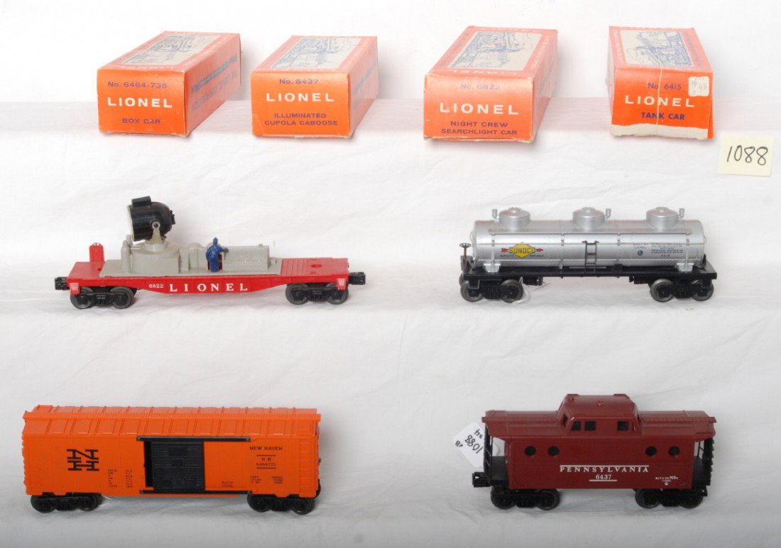 Lionel 6415, 6822, 6464-735, and 6437 in OB: Postwar Lionel O gauge 6415 Sunoco tank, 6822 night crew searchlight car, 6464-735 New Haven boxcar, and 6437 illuminated Pennsylvania porthole cupola caboose, freight cars in original boxes, C7-8. 64