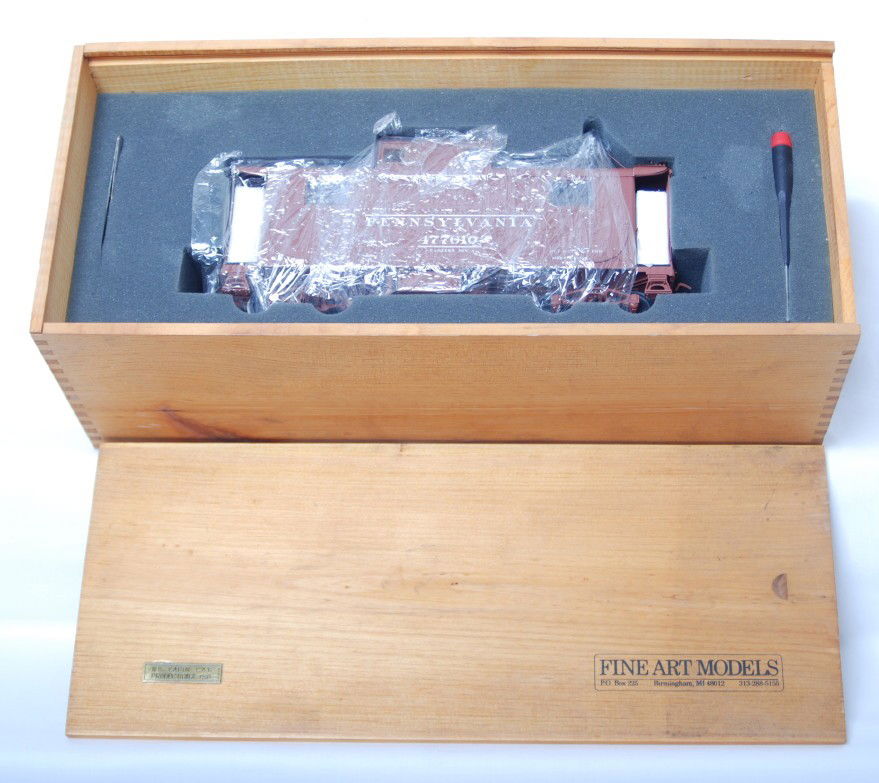 Fine Art Models Pennsylvania N5 caboose: Fine Art Models G scale / one gauge Pennsylvania N5 tuscan caboose in the original wooden case. Caboose is factory wrapped and all add on detail parts are still sealed in the bag. C10 condition. Produ