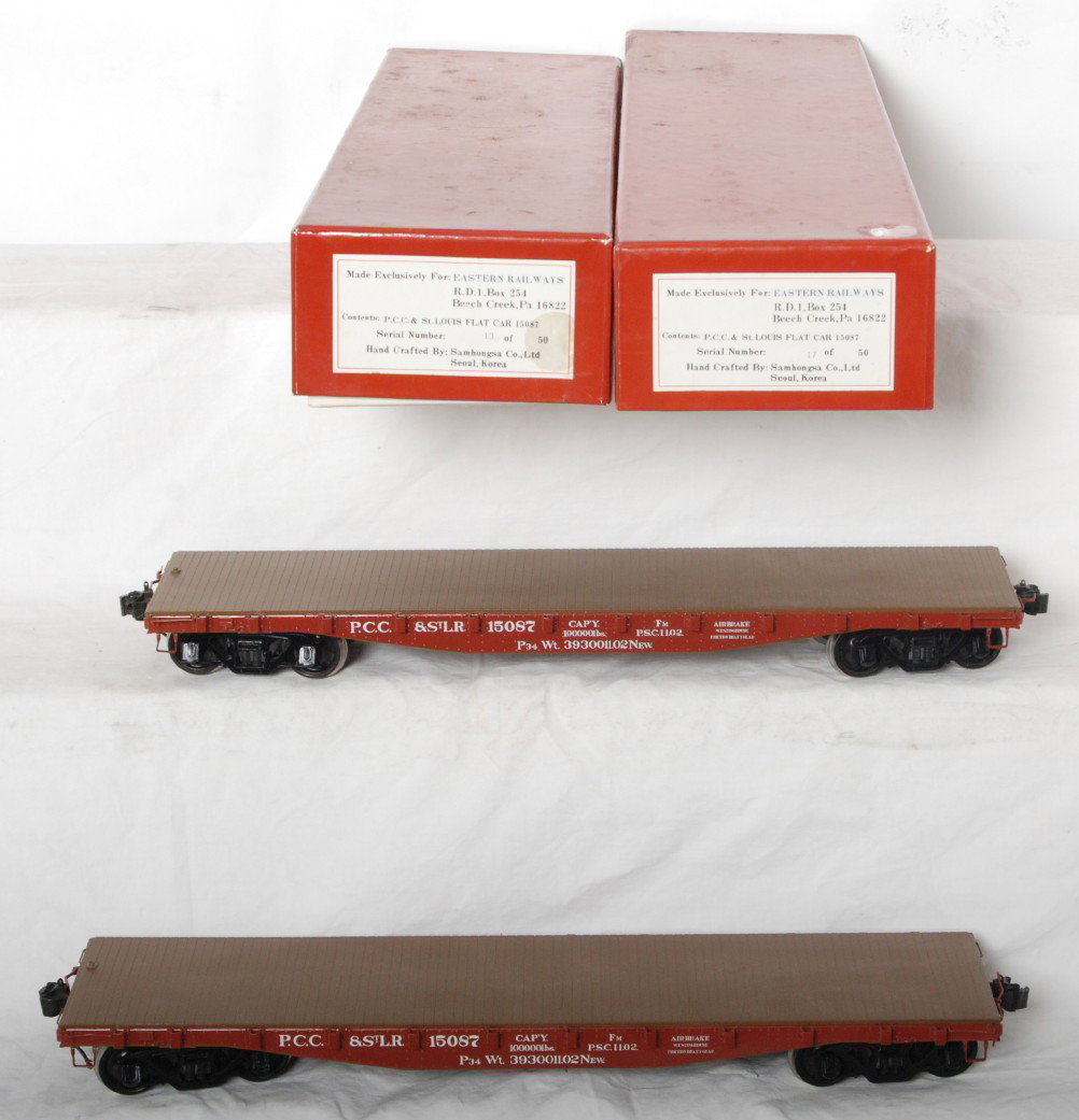 2 Eastern Railways PCC& StL flat cars: Eastern Railways modern one gauge / G scale flat cars in OBs. These cars are lettered for P.C.C. and St. Louis/ Cars are 13 and 17 of 50 respectively. Cars are C9-10. One rust spot on one axle.