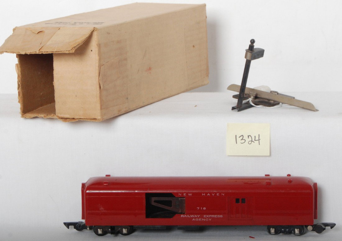 American Flyer 718 New Haven REA baggage car in O: Postwar American Flyer S gauge 718 New Haven REA baggage car with track terminal and a white mail bag missing a handle. Train has a very tiny chip to a lower corner and two very small hairlines to oth