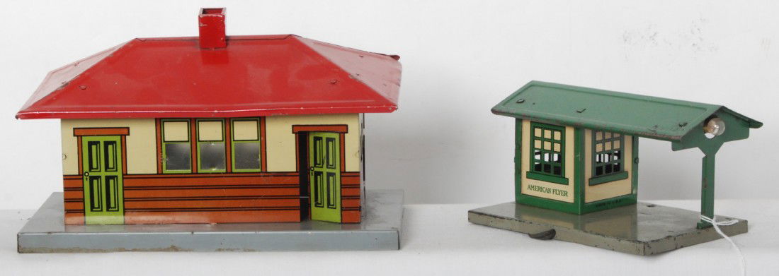 Two American Flyer tinplate buildings, stations: Prewar American Flyer tinplate stations/building, C6. Both buildings are illuminated.