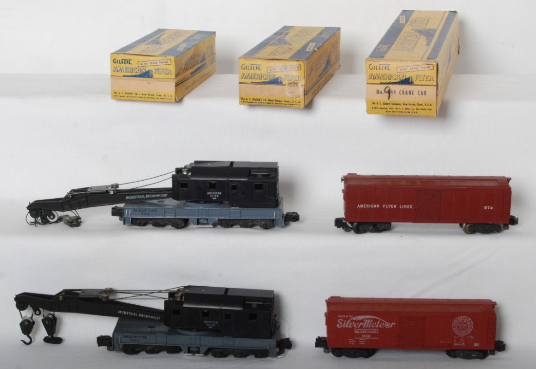 American Flyer 974 in OB, 942 in OB, 944 in OB, 9: Postwar American Flyer S gauge 974 operating boxcar, 942 Seaboard Silver Meteor boxcar, and two 944 Industrial Brownhoist cranes (one is missing coupler knuckle), C6-7. 944 is in a 644 OB, 974 is in a