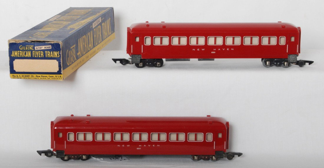 Two American Flyer 650 New Haven coaches, red, 1 : Postwar American Flyer S gauge 650 New Haven passenger coach. Both have chips and cracks at corners and one has a partially missing step. One original box, with some wear and tear to an end flap, othe