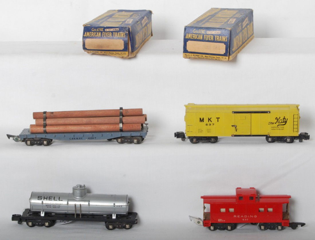 American Flyer 625 in OB, 42597, 630 in OB, 637: Postwar American Flyer S gauge 625 Shell tank, 42597 C&NW lumber car, 637 MKT boxcar, and 630 Reading caboose. Trains have missing and converted couplers, otherwise trains should clean C6-7. 625 and 6
