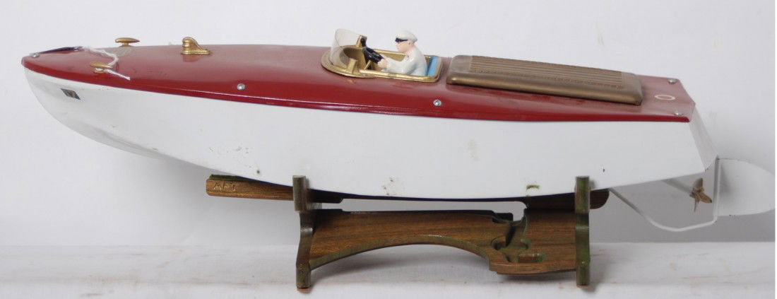 Orkin Fleet Runabout mechanical speedboat pond la: Orkin Fleet ÒRunaboutÓ No. 17 windup mechanical tin/metal speed pond/lake boat. Motor feels to hold tension, but does not run when the lever is in run position. Boat has been restored to look C7-8 a