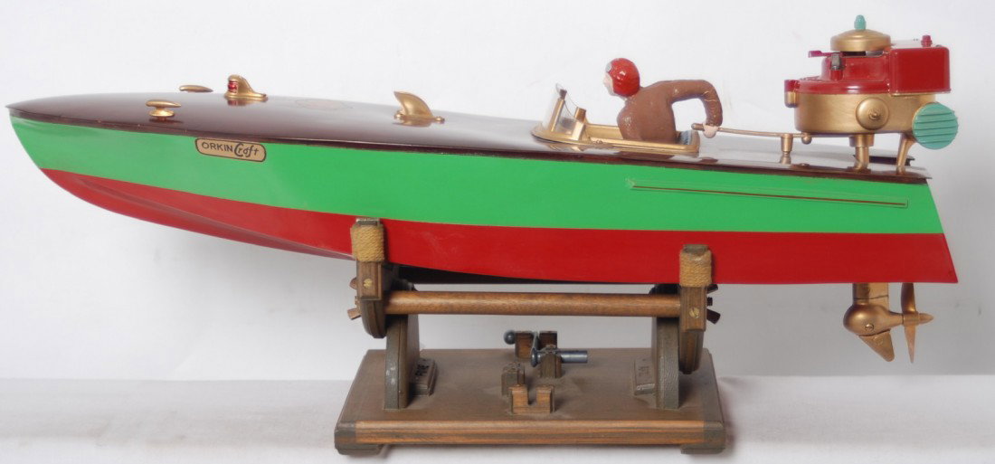 Orkin Craft motor boats Outboarder w/motor on sta: Pond/lake boat by Orkin Craft Scale Model Motor Boats, ÒOutboarderÓ speed boat with driver, motor, winding key/lever (marked original), and a nice stand. Boat has been restored to look C8-9. Motor f