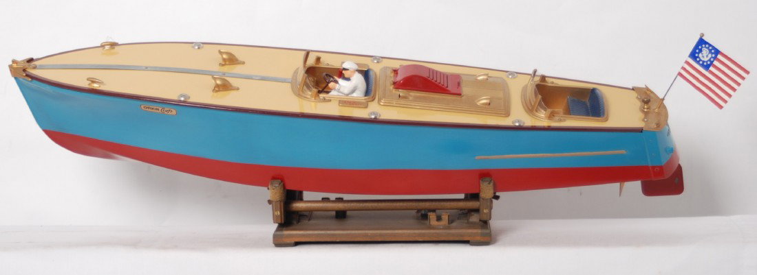Orkin Craft Tender mechanical speedboat pond boat: Orkin Craft Scale Model Motor Boats, ÒTenderÓ pond/lake boat with driver, motor, and a nice stand. Boat has been restored to look C8-9. Boat measures approximately 31 inches bow to tip of rudder and