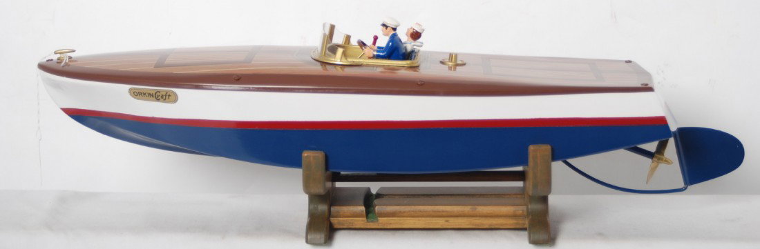 Orkin Craft factory metal construction Expertly r: Fantastic looking Orkin Craft speed boat that has been superbly restored to look C9-10. Motor accepts tension and works. Boat is on a custom made wood stand. Boat measures approximately 22 inches leng