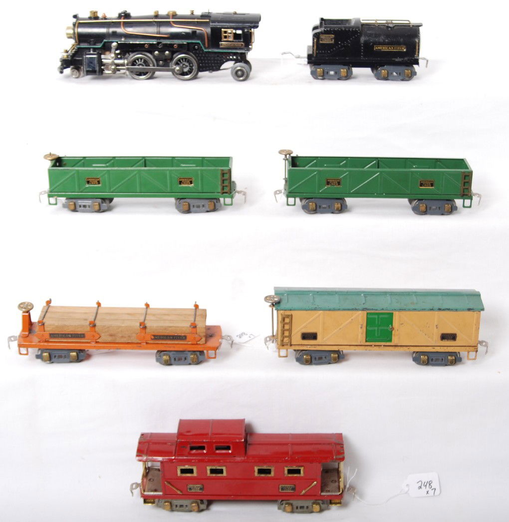 American Flyer O ga. loco & tender with five freig: Prewar American Flyer O gauge diecast steam locomotive with diecast Vanderbilt tender and two 3207 sand cars, 3206 lumber car (original lumber and load restraints), 3208 boxcar, and a 3211 caboose. Lo