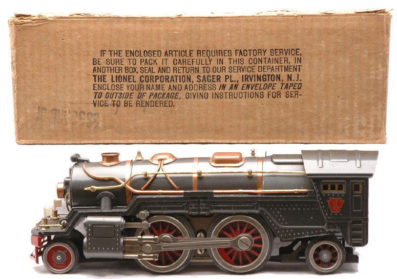 Lionel 385E Gunmetal 2-4-2 Steam Loco OB: Lionel prewar standard gauge 385E gunmetal 2-4-2 steam loco with copper and brass trim in worn OB. The steam chest on the loco has been restored. The loco is C7.