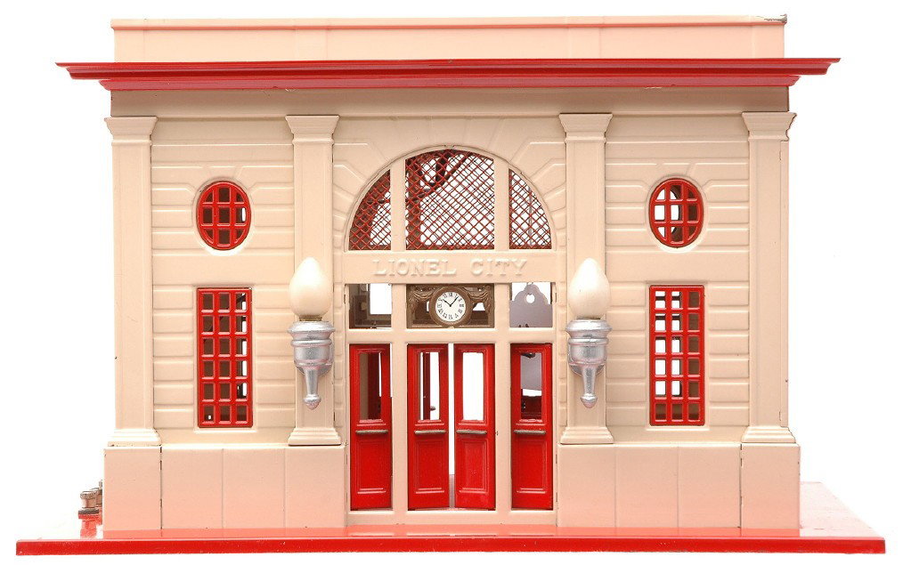 Lionel Std.Ga.115 Ivory/Vermilion Lighted Station: Lionel prewar standard gauge 115 ivory and vermilion lighted station with aluminum painted light fixtures. Two holes were drilled in two corners of the base. Station is C7.