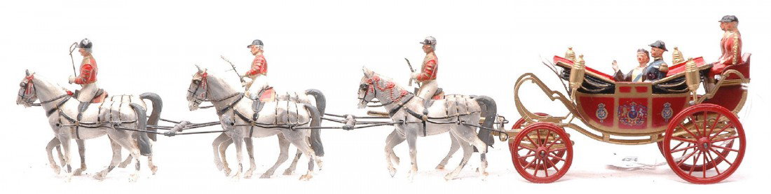 Britains Royal Carriage w/six Horses: Britains royal carriage with the H.M. the Queen, H.R.H. The Duke of Edinburgh and two figures in the 1902 state open road Landau, that has a team of six horses pulling the carriage. There are three ri