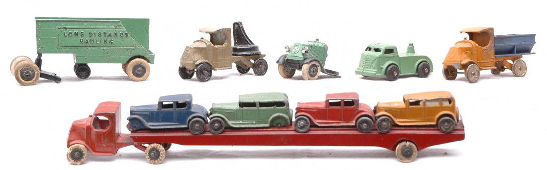 TootsieToy 0190X 4-Car Transport Mack Trucks: TootsieToy no. 0190X four car transport set. Also included are TootsieToy Mack trucks and a no. 803 long distance hauling truck that is broken. Vehicles show moderate paint wear.